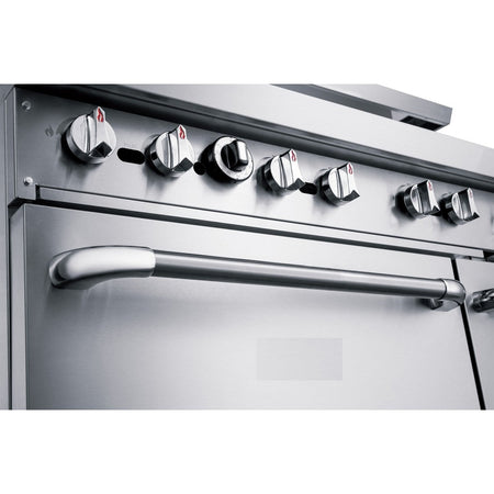 a stainless steel oven with four burners and knobs