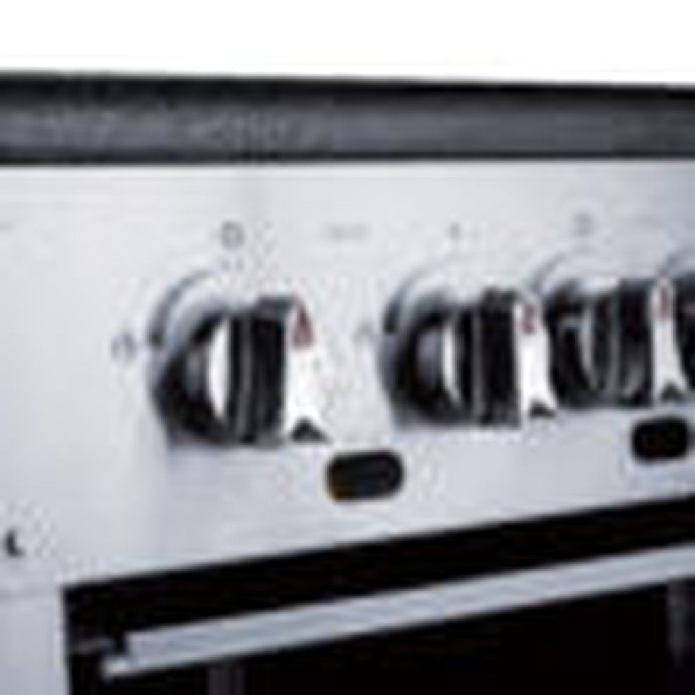 a close up of a metal oven with knobs